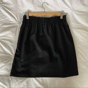 Black wool mini skirt with pockets